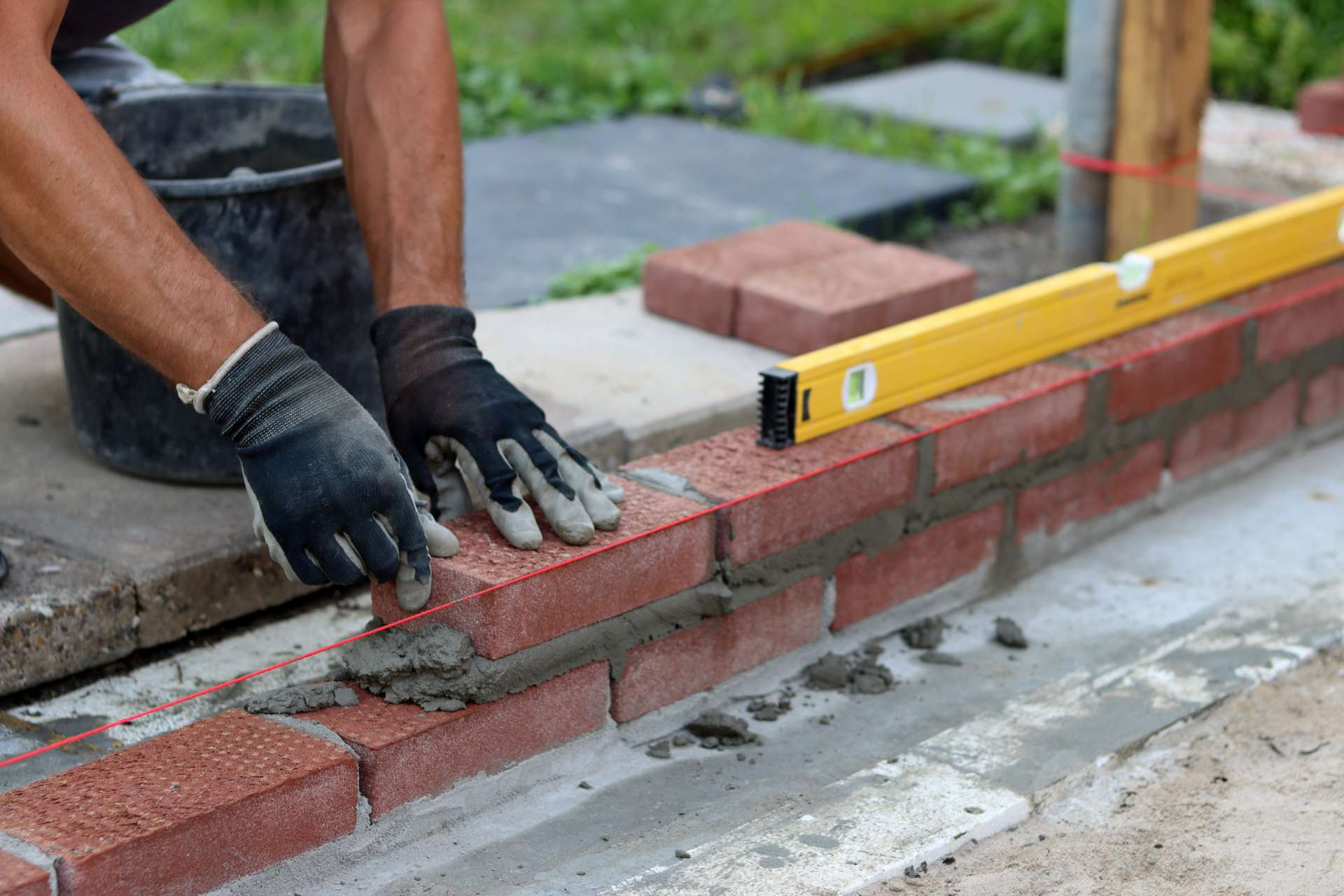 Mason repairing brick chimney
